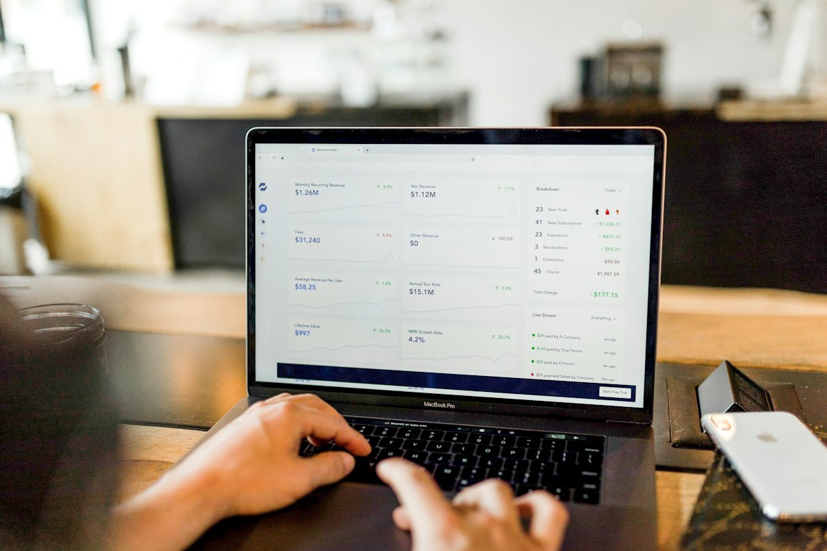 Person using a laptop displaying an online business and e-commerce dashboard