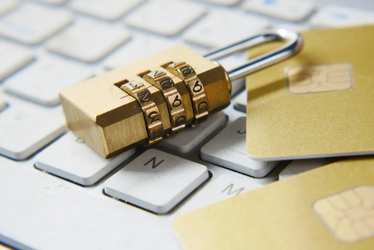 Combination lock and payment cards on a computer keyboard