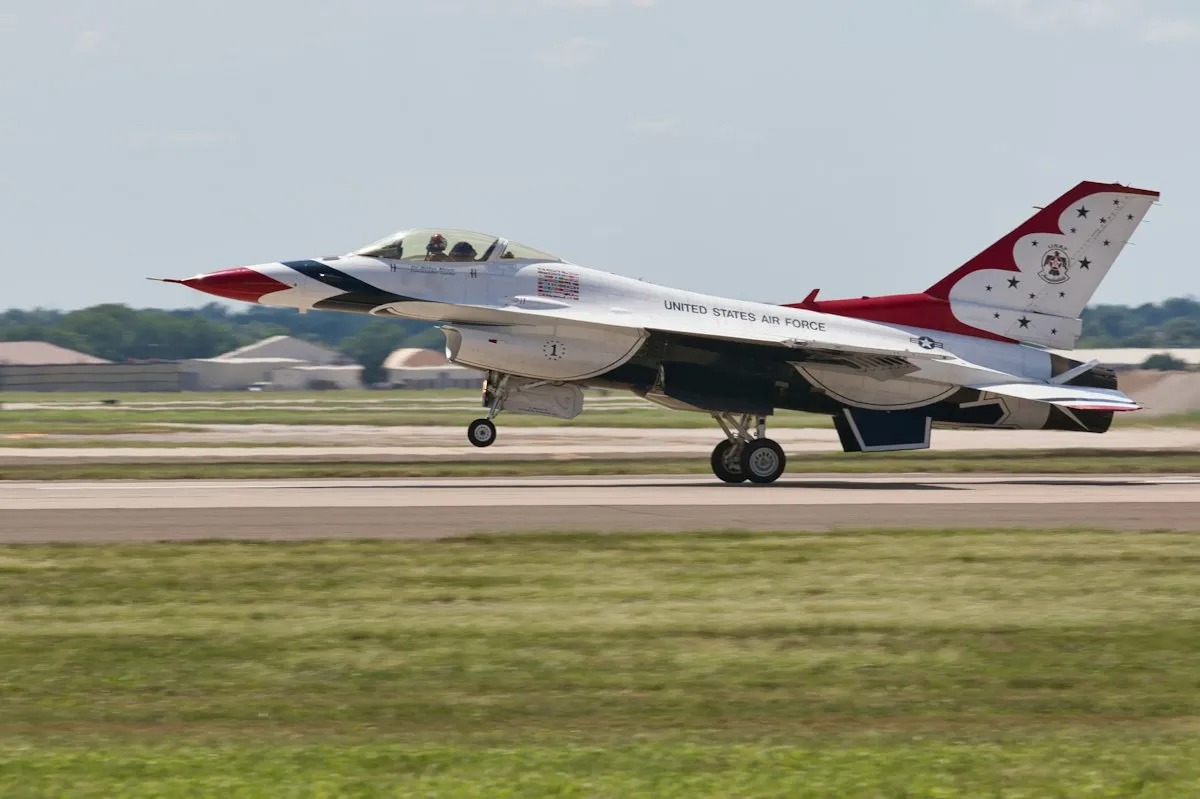 United States Air Force F-16 Thunderbird fighter jet landing on a runway