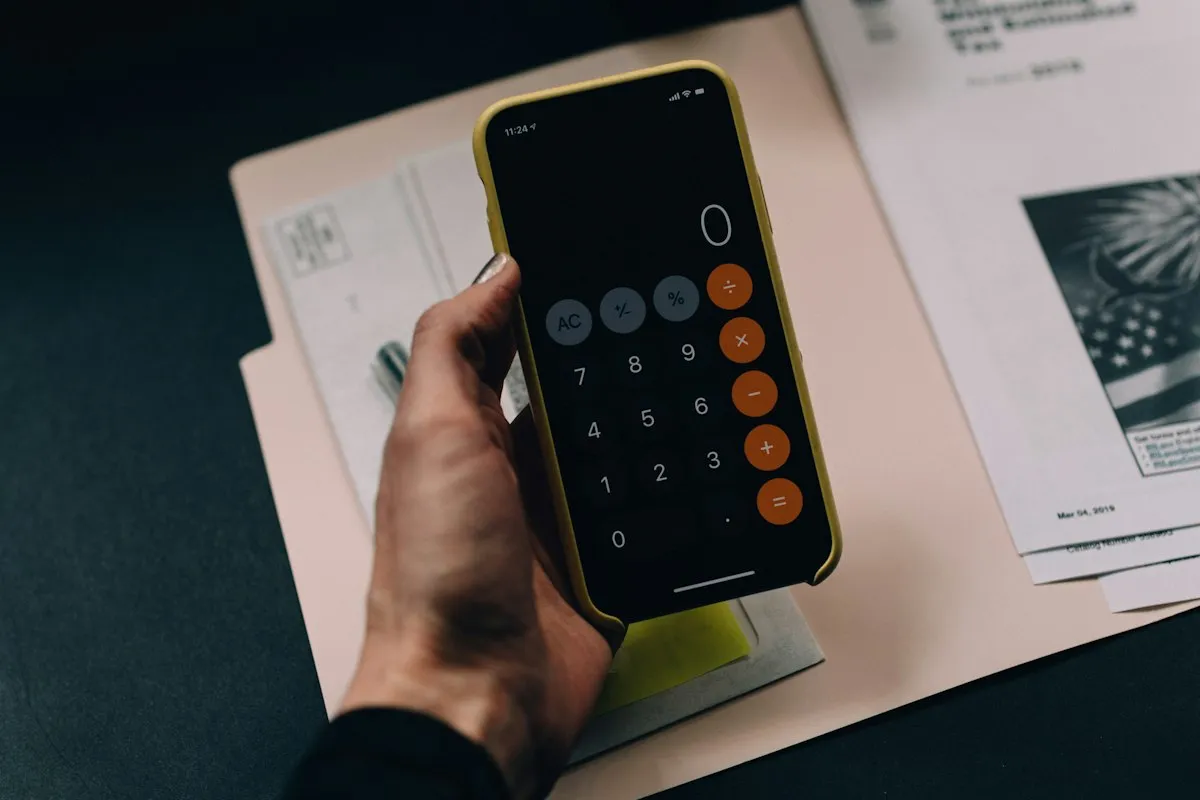 Calculator and financial documents on a desk