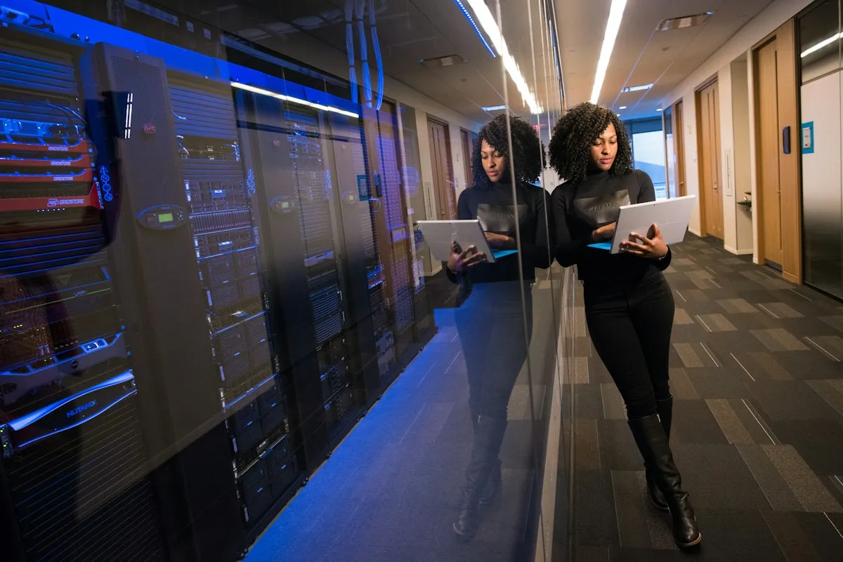 Technology professionals reviewing server infrastructure in a data center