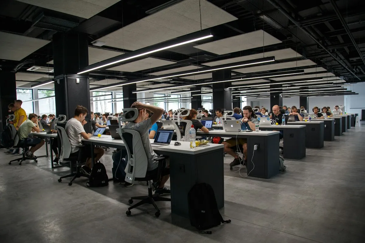 Technology operations team working across connected workstations