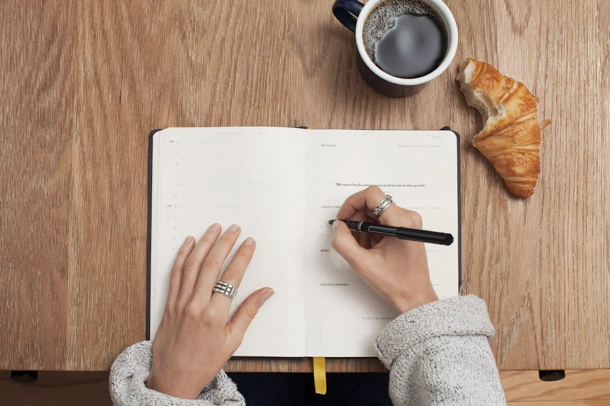 Hands organizing documents and a written assessment plan