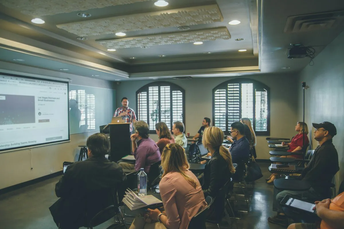 Instructor presenting a technology lesson to a classroom of learners