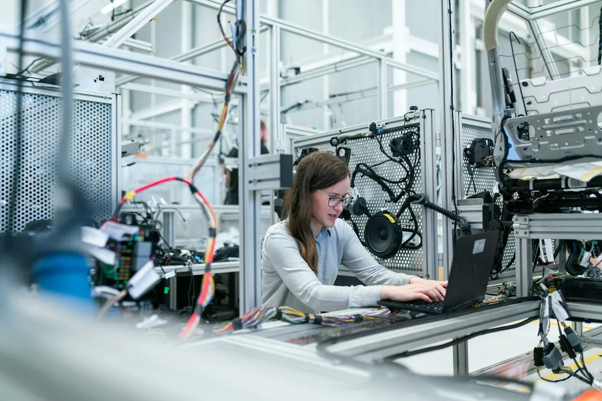 Technology professional working with connected equipment in a technology workspace